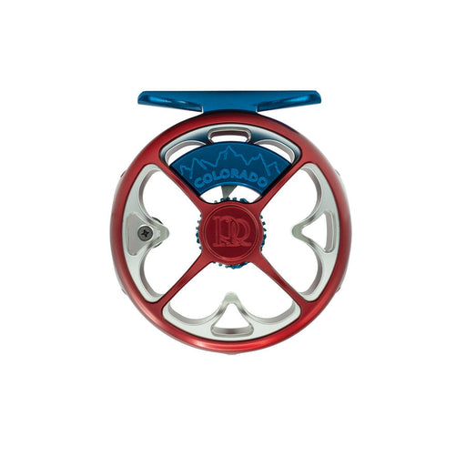 Ross Colorado Liberty limited edition click pawl fly reel in silver machined aluminum, displaying a custom blue anodized reel foot and inner frame accents with a red internal clicker housing.