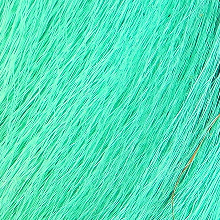 A close-up view of Hareline Pastel Northern Bucktail in Pastel Minnow Blue #234, showing long, straight natural deer hair dyed in a soft, glowing ice-blue shade.