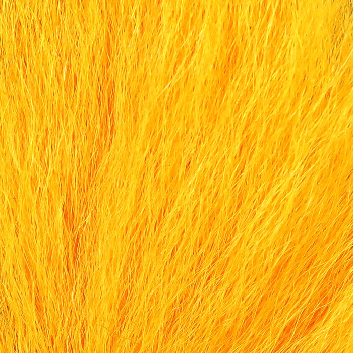 A close-up view of Hareline Pastel Northern Bucktail in Pastel Orange #271, showcasing long, crinkled deer hair fibers in a smooth, warm pastel orange finish.