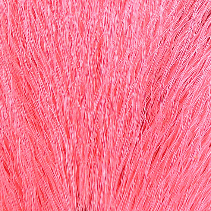A close-up view of Hareline Pastel Northern Bucktail in Pastel Red #310, highlighting a dense patch of natural deer tail hair in a soft, vibrant pastel pinkish-red hue.