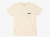 Front view of the ivory Yakoda Rise Early Short Sleeve Pocket Tee showing the left chest pocket and minimal logo.