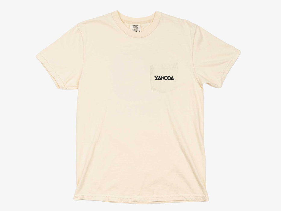 Front view of the ivory Yakoda Rise Early Short Sleeve Pocket Tee showing the left chest pocket and minimal logo.